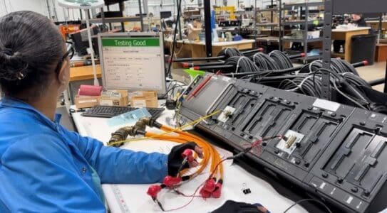 PGF Team Member testing a wire harness assembly